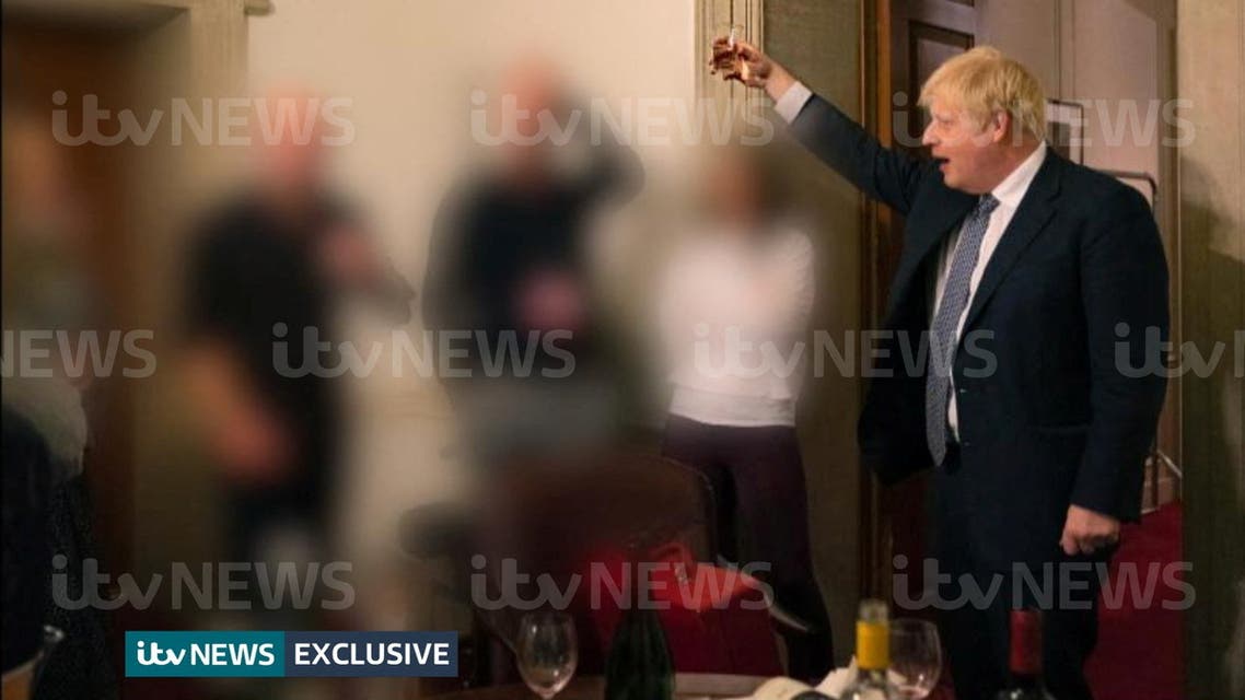 A handout picture shows British Prime Minister Boris Johnson raising a glass during a party at Downing Street, amid the coronavirus disease (COVID-19) pandemic in London, Britain November 13, 2020. (Reuters)