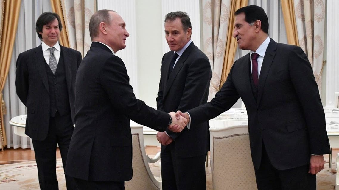 Russian President Vladimir Putin (2nd L) shakes hands with Sheikh Abdulla bin Mohammed bin Saud Al-Thani, chief executive of the Qatar Investment Authority (QIA), as Bank Intesa CEO Carlo Messina (L) and Glencore CEO Ivan Glasenberg (3rd L) stand beside during a meeting with participants of Rosneft privatisation deal at the Kremlin in Moscow on January 25, 2017. (AFP)
