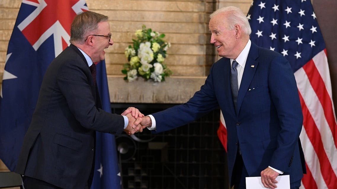 US President Joe Biden shakes hands with Australian Prime Minister Anthony Albanese (L) prior to their meeting during the Quad Leaders Summit at Kantei in Tokyo on May 24, 2022. (AFP)