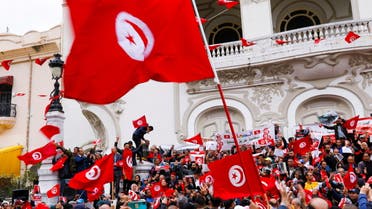 People carry flags during a rally in support of Tunisian President Kais Saied in Tunis, Tunisia May 8, 2022. REUTERS/Zoubeir Souissi