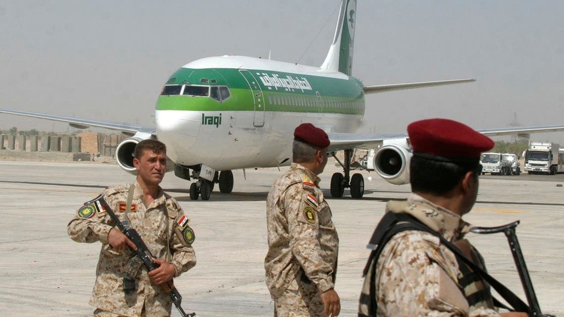 A file photo shows members of the Iraqi security forces stand guard during the opening ceremony of a new airport in Najaf, about 160 km (100 miles) south of Baghdad, July 20, 2008. (Reuters)