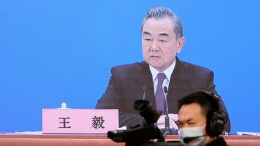 Chinese State Councilor and Foreign Minister Wang Yi is seen on a screen as he attends a news conference via video link on the sidelines of the National People's Congress (NPC), in Beijing, China March 7, 2022. (File photo: Reuters)