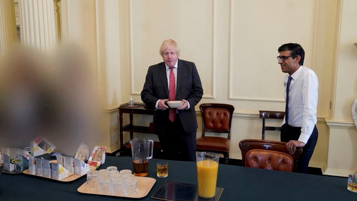 British Prime Minister Boris Johnson gestures in 10 Downing Street during gathering on the departure of a special adviser, in London, Britain November 13, 2020 in this picture obtained from civil servant Sue Gray's report published on May 25, 2022. Sue Gray Report / gov.uk/Handout via REUTERS ATTENTION EDITORS - THIS IMAGE HAS BEEN SUPPLIED BY A THIRD PARTY. NO RESALES. NO ARCHIVES. MANDATORY CREDIT.