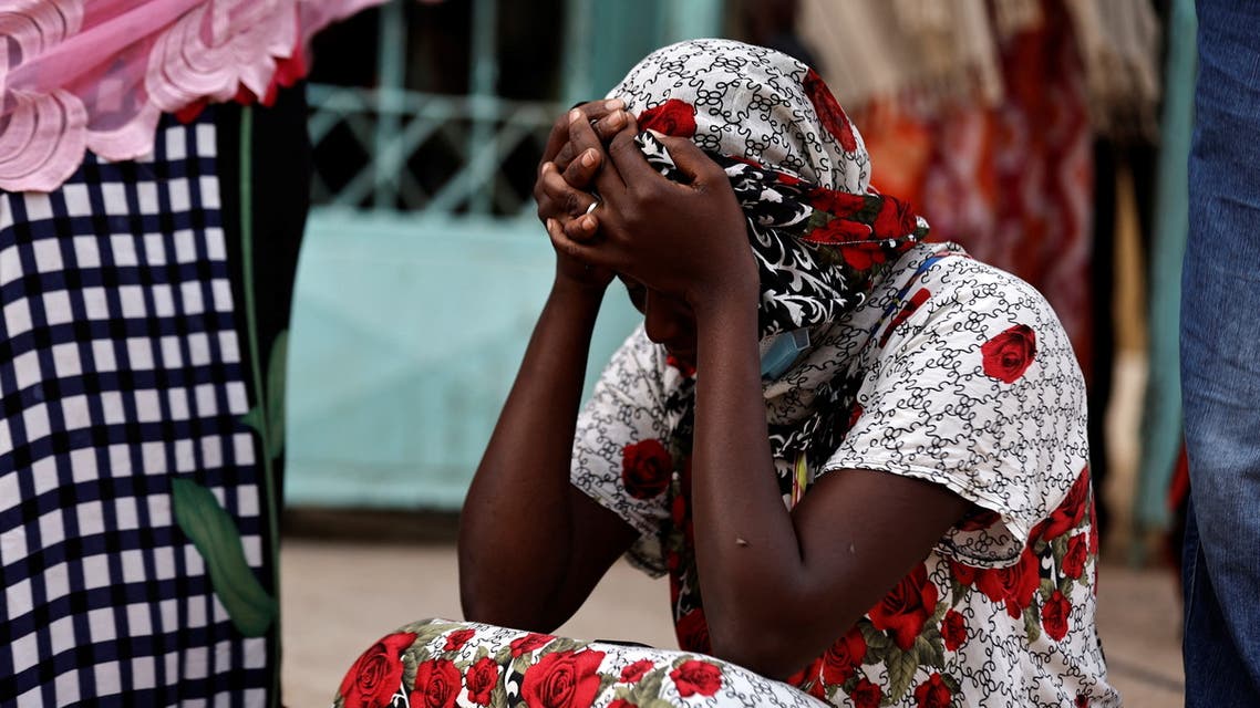 Kaba, a mother of a ten-day-old baby, reacts as she sits outside the hospital, where newborn babies died in a fire at the neonatal section of a regional hospital in Tivaouane, Senegal, May 26, 2022. (Reuters)
