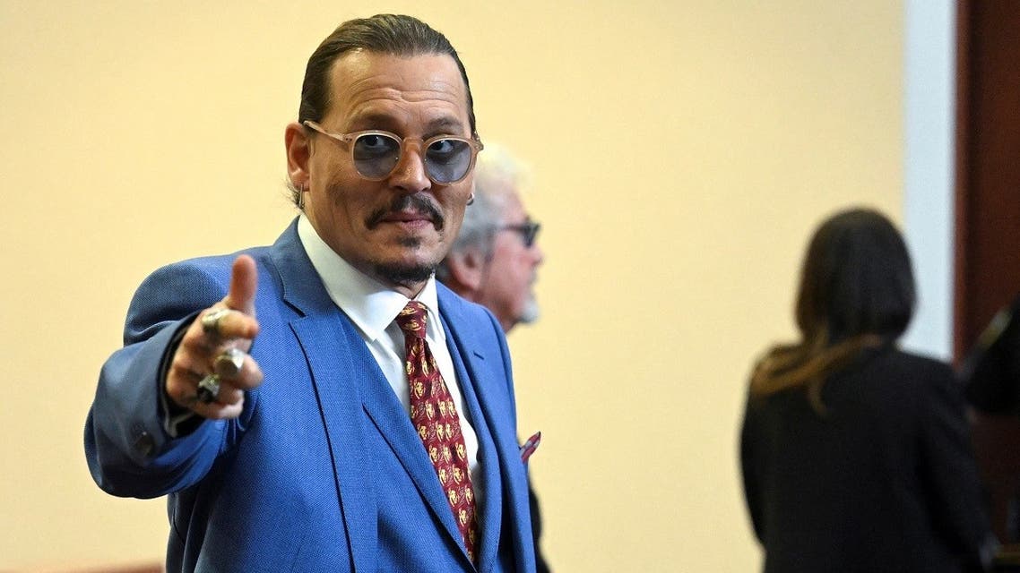 Actor Johnny Depp gestures while departing the courtroom, during his defamation trial against ex-wife, actor Amber Heard, at the Fairfax County Circuit Courthouse in Fairfax, Virginia, US, May 24, 2022. (Jim Watson/Pool via Reuters)