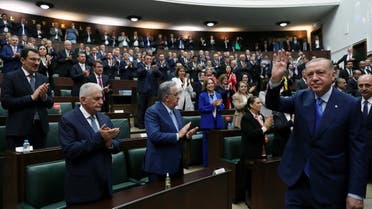 Turkish President Tayyip Erdogan greets members of his ruling AK Party (AKP) during a meeting at the parliament in Ankara, Turkey May 18, 2022. (Reuters)