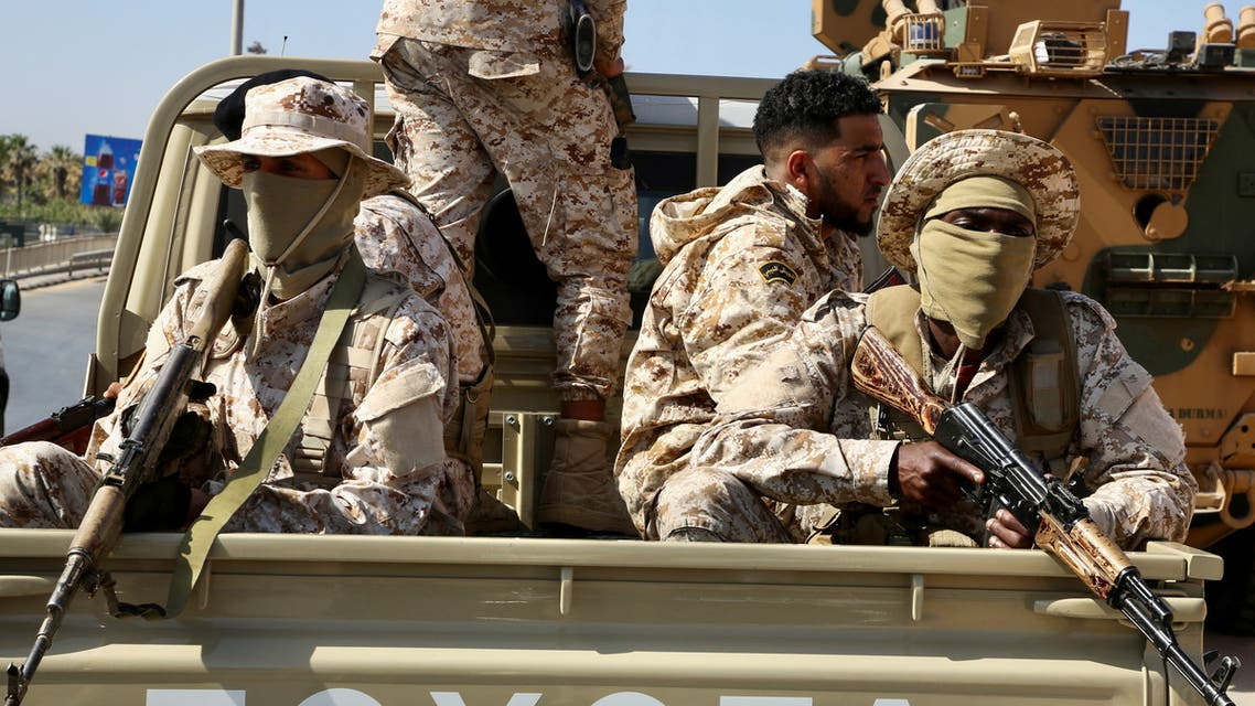 Soldiers loyal to the head of Libya's Government of National Unity, Abdulhamid al-Dbeibah, sit in the back of a truck in Tripoli, Libya, May 17, 2022. (File photo: Reuters)