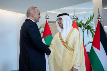 Sheikh Mansour bin Zayed shakes hands with Jordanian Prime Minister Bisher al-Khasawneh in Abu Dhabi on May 29, 2022. (WAM) 