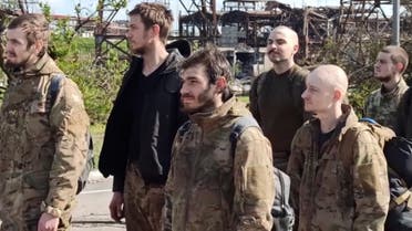 In this photo taken from video released by the Russian Defense Ministry on Friday, May 20, 2022, Ukrainian servicemen are pictured as they leave the besieged Azovstal steel plant in Mariupol, in territory under the government of the Donetsk People's Republic, eastern Ukraine. (Russian Defense Ministry Press Service via AP)