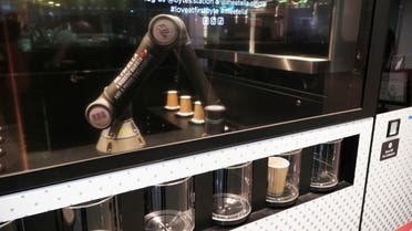Robot barista “Ella,” designed by Crown Digital, makes a coffee autonomously after receiving orders, in Singapore. (Reuters)