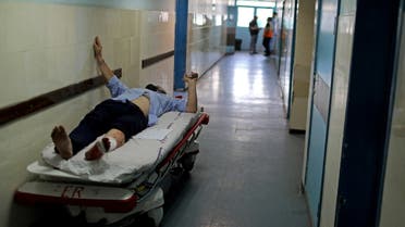 A wounded Palestinian man lies on a bed in Shifa hospital in Gaza City May 17, 2021. (File photo: Reuters)