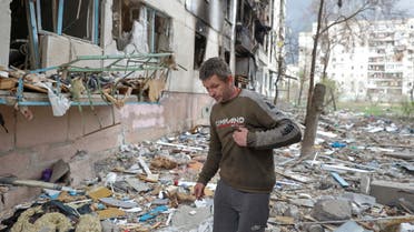 Local resident Viacheslav walks on debris of a residential building damaged by a military strike, as Russia's attack on Ukraine continues, in Sievierodonetsk, Luhansk region, Ukraine April 16, 2022. REUTERS/Serhii Nuzhnenko/File Photo