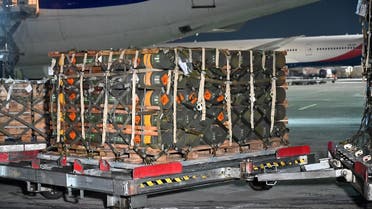 A picture taken on January 25, 2022 shows pallets of ammunition, weapons and other equipment while employees unload a plane with a new US security assistance provided to Ukraine at Kyiv’s airport Boryspil. (AFP)