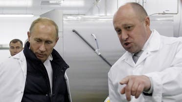 Businessman Yevgeny Prigozhin shows Russian Prime Minister Vladimir Putin his school lunch factory outside Saint Petersburg on September 20, 2010. (AFP)