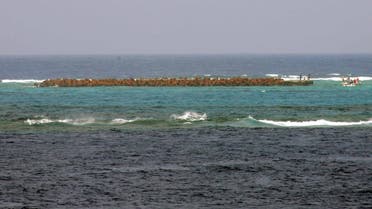 A fifty meter outcropping named Higashikojima, protected by a steel net and embankment, is seen from Okinotori island, about 1,700 km (1,056 miles) south of Tokyo in the Pacific Ocean. (File photo: Reuters)