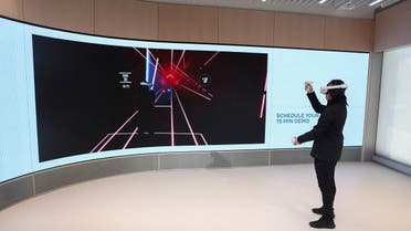 Chris Nguyen, an experience expert, demonstrates the Quest Experience during a preview of the inaugural physical store of Facebook-owner Meta Platforms Inc in Burlingame, California, US, on May 4, 2022. (Reuters)