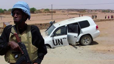 In this file photo taken on July 16, 2016 shows a soldier of the United Nations mission to Mali MINUSMA standing guard near a UN vehicle after it drove over an explosive device near Kidal, northern Mali. (AFP)