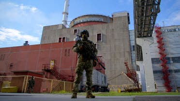 In this file photo taken on May 01, 2022 a Russian serviceman stands guard at the territory outside the second reactor of the Zaporizhzhia Nuclear Power Station in Energodar. (AFP)