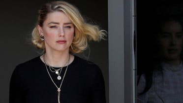 Amber Heard leaves Fairfax County Circuit Courthouse after the jury announced split verdicts in favor of both her ex-husband Johnny Depp and Heard on their claim and counter-claim in the Depp v. Heard civil defamation trial at the Fairfax County Circuit Courthouse in Fairfax, Virginia, U.S., June 1, 2022. REUTERS/Tom Brenner TPX IMAGES OF THE DAY