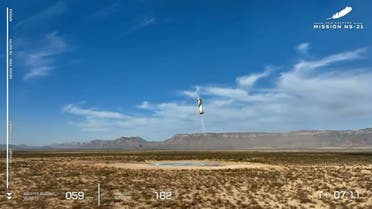 In this still image taken from a Blue Origin broadcast, the NS-21 Blue Origin New Shepard booster rocket comes in for landing in West Texas north of Van Horn on June 4, 2022. The NS-21 mission is the fifth crewed flight for Blue Origin. (Handout/various sources/AFP)