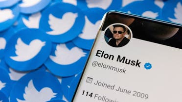  Elon Musk's Twitter profile is seen on a smartphone placed on printed Twitter logos in this picture illustration taken April 28, 2022. (File photo: Reuters)