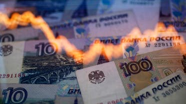 A reflection of a yearly chart of U.S. dollars and Russian roubles are seen on rouble notes in this photo illustration. (File photo: Reuters)