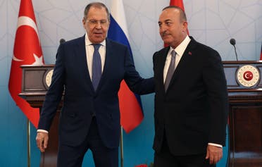 Russian Foreign Minister Sergey Lavrov (L) and Turkish Foreign Minister Mevlut Cavusoglu (R) speak after a news conference in Ankara, on June 8, 2022. (AFP)
