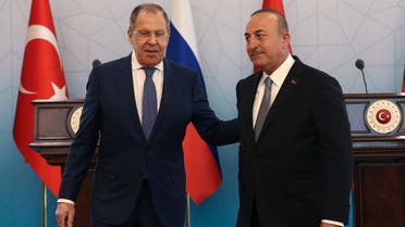 Russian Foreign Minister Sergey Lavrov (L) and Turkish Foreign Minister Mevlut Cavusoglu (R) speak after a news conference in Ankara, on June 8, 2022. (AFP)
