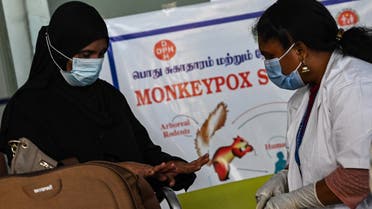 Health workers screen passengers arriving from abroad for Monkeypox symptoms at Anna International Airport terminal in Chennai on June 03, 2022.