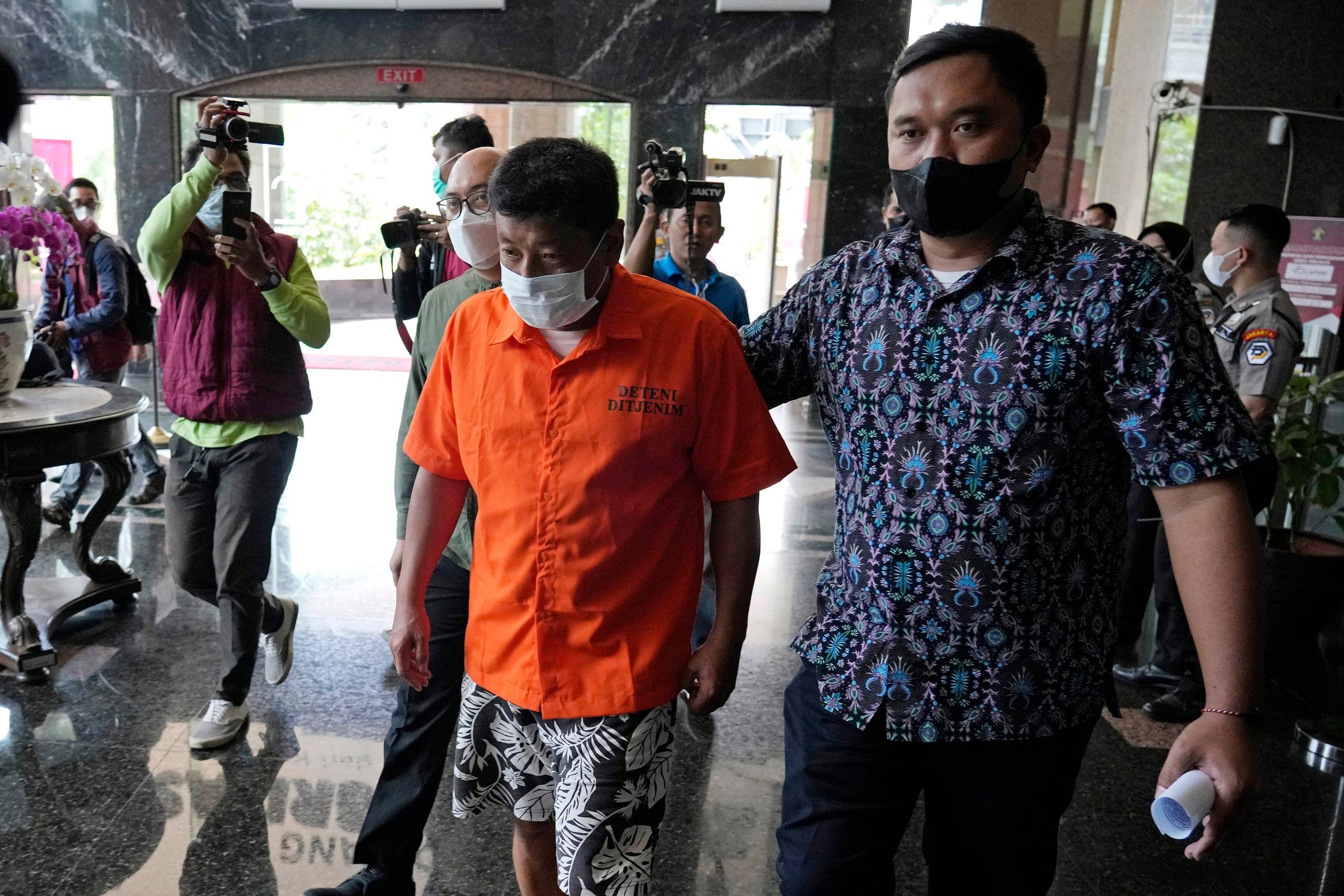 Mitsuhiro Taniguchi in the custody of the Indonesian police