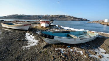 Boats are seen on the bank of a bay near Krabozavodskoye settlement on the Island of Shikotan, one of four islands known as the Southern Kuriles in Russia and the Northern Territories in Japan, December 19, 2016. REUTERS/Yuri Maltsev