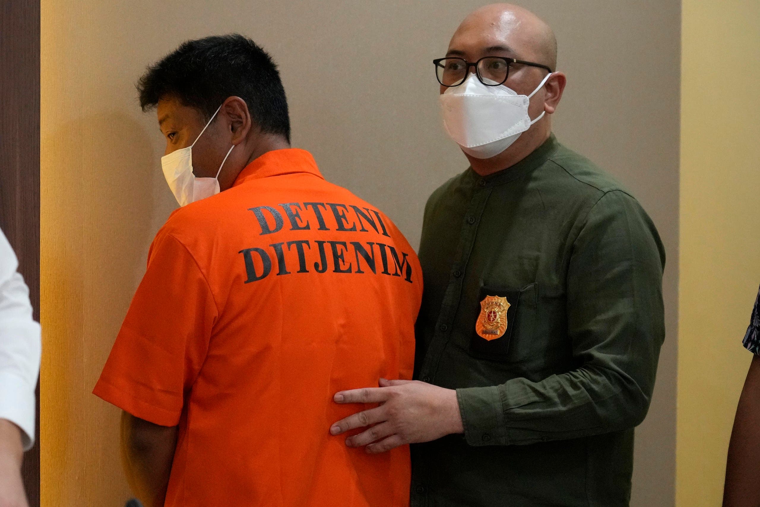 Mitsuhiro Taniguchi in the custody of the Indonesian police