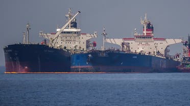 The Liberian-flagged oil tanker Ice Energy (L) transfers crude oil from the Russian-flagged oil tanker Lana (R) (former Pegas), off the shore of Karystos, on the Island of Evia, on May 29, 2022. (AFP)