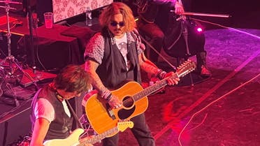 Actor Johnny Depp joins musician Jeff Beck on stage during a concert, in Gateshead, Britain June 2, 2022 in this picture obtained by Reuters from social media. (Reuters)