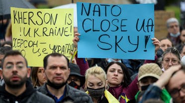 Protestors hold signs reading Kherson is Ukraine! and NATO, close Ukraine's sky during a demonstration to protest against Russia's invasion. (File Photo: AFP)