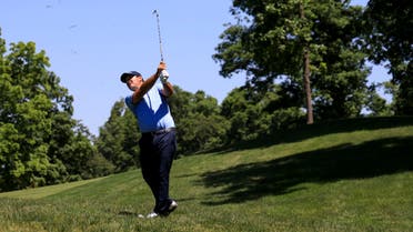 Patrick Reed plays his shot from the ninth fairway rough during the second round of the Memorial Tournament. (Reuters)