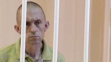 A still image, taken from footage of the Supreme Court of the self-proclaimed Donetsk People's Republic, shows British citizen Shaun Pinner captured by Russian forces during a military conflict in Ukraine, in a courtroom cage at a location given as Donetsk, Ukraine, in a still image from a video released June 8, 2022. (Reuters)