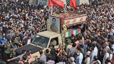 Mourners gather around the coffin of Iran's Revolutionary Guards colonel Sayyad Khodai during a funeral procession at Imam Hussein square in the capital Tehran, on May 24, 2022. (AFP)