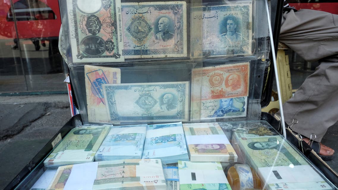 A man displays the Iranian currency at Ferdowsi square in Tehran, Iran July 2, 2020. (Reuters)