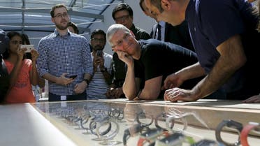 Apple CEO Tim Cook looks over a selection of Apple Watches in Palo Alto, California. (File photo: Reuters)