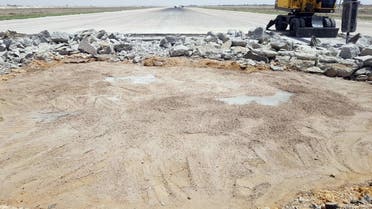 A heavy machine operates at the tarmac of Damascus International Airport, Syria, in this handout released by SANA on June 12, 2022. (Reuters)