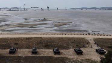 This photo taken on October 20, 2020 shows an aerial view of anti-landing spikes and retired tanks placed along the coast of Taiwan’s Kinmen islands, which lie just 3.2 kilometers (two miles) from the mainland China coast (in background) in the Taiwan Strait. (AFP)