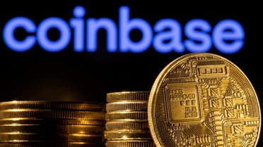 A representation of the cryptocurrency is seen in front of Coinbase logo in this illustration taken, March 4, 2022. (Reuters)