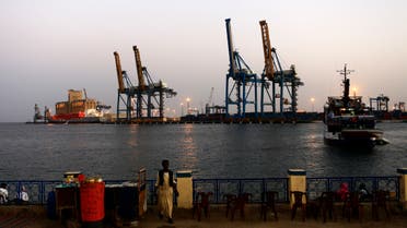 A man stands opposite the modern port at the harbour in Port Sudan at Red Sea State February 24, 2014. (File photo: Reuters)