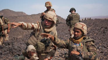 French Army General Bernard Barrera (L) speaks with a French soldier during a patrol in the Tigharghar valley, about 100 km (62 miles) south of the town of Tessalit in northern Mali March 23, 2013. (