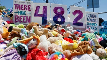 Stuffed animals lay before a sign posted during a demonstration urging the Food and Drug Administration authorize vaccines for children under 5 at the FDA on May 09, 2022 in Washington, DC. (AFP)