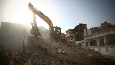 A bulldozer demolishes the house of a Muslim man that Uttar Pradesh state authorities accuse of being involved in riots last week, that erupted following comments about Prophet Mohammed by India's ruling Bharatiya Janata Party (BJP) members, in Prayagraj, India, June 12, 2022. (Reuters)