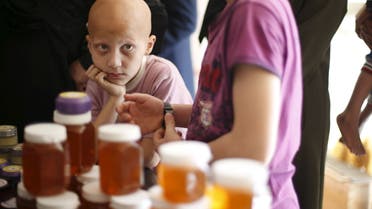 A boy who suffers from alopecia areata waits to receive bee-sting therapy at Rateb Samour's clinic in Gaza City April 11, 2016. (File photo: Reuters)