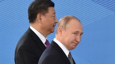 Russian President Vladimir Putin and Chinese President Xi Jinping walk as they attend a meeting on June 14, 2019. (File photo: AFP)