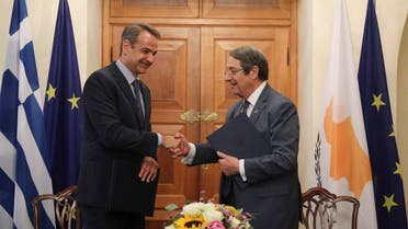 Cypriot President Nicos Anastasiades shakes hands with Greek Prime Minister Kyriakos Mitsotakis during a meeting at the Presidential Palace in Nicosia, Cyprus June 17, 2022. (Reuters)